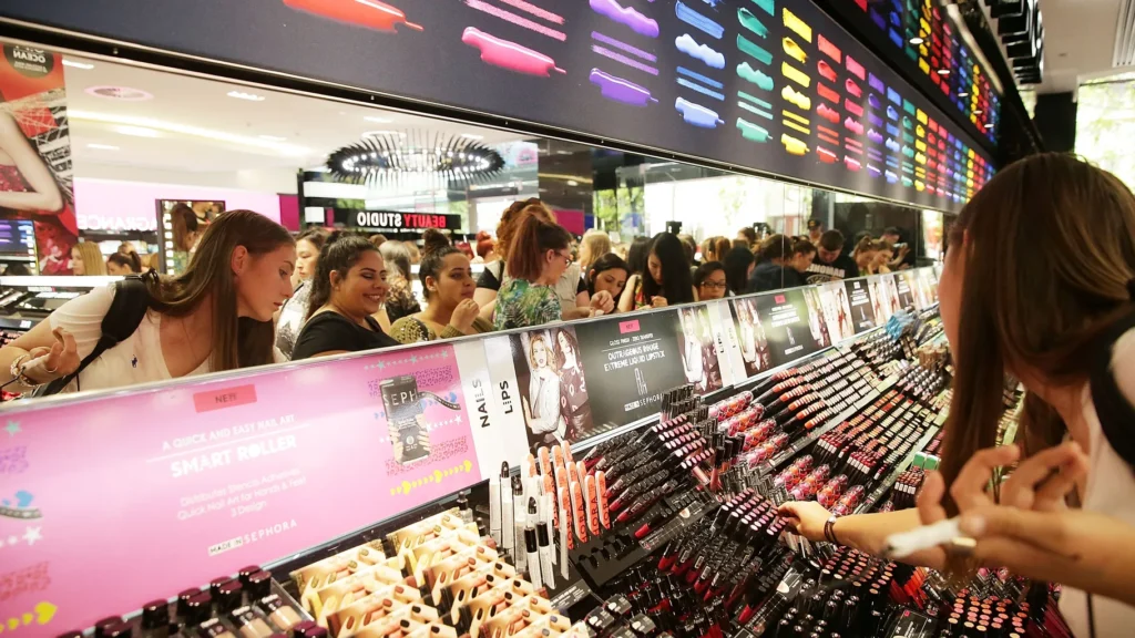 Enthusiastic shoppers exploring the diverse beauty offerings at Sephora, indulging in skincare, makeup, fragrances, and more.